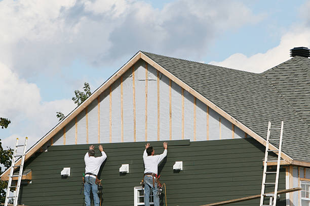 Professional Storm Damage Siding Repair technician working in Boonville, IN